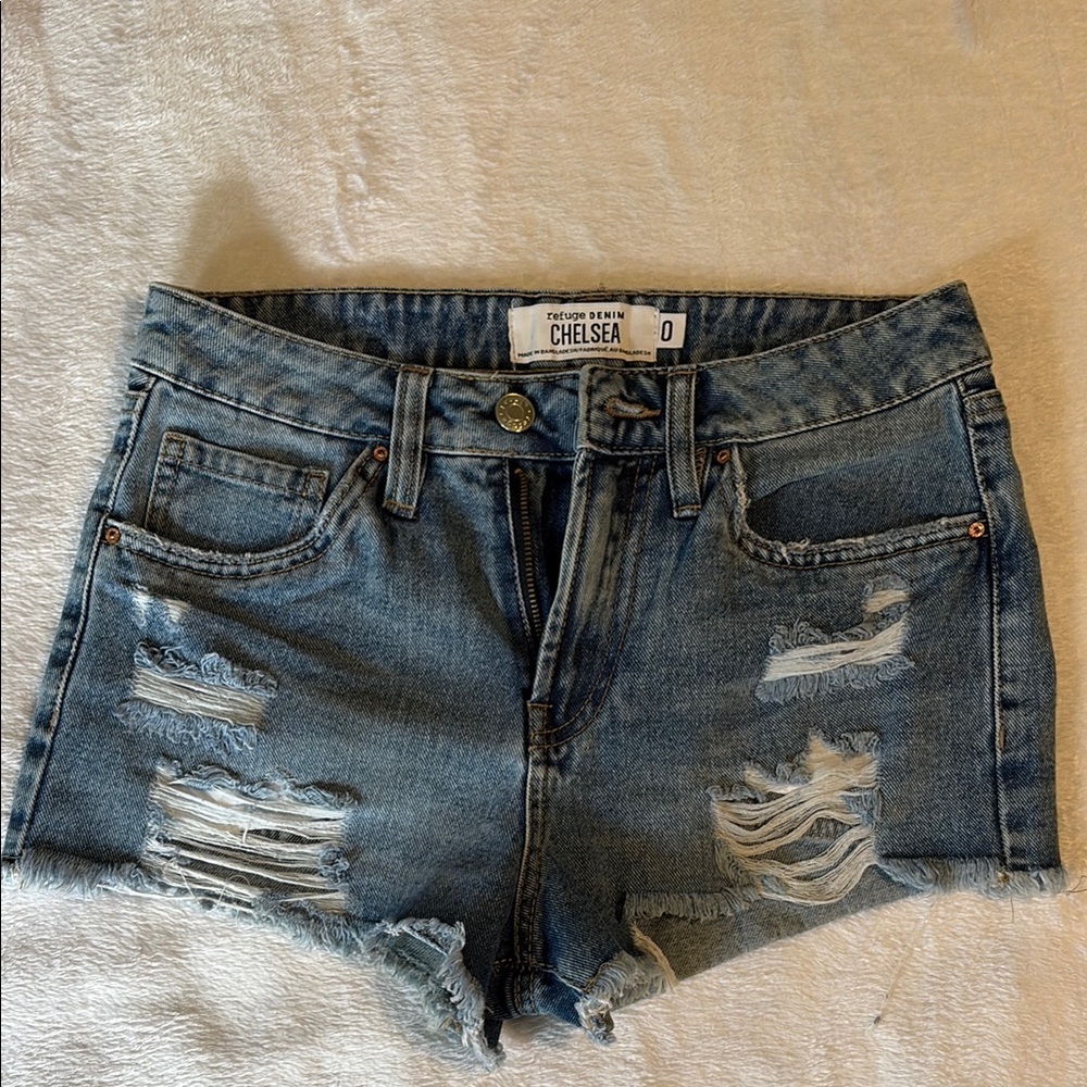 Woman’s Distressed Blue Denim Shorts